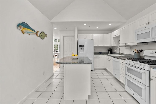 47 Blue Spruce Way Unit 47, Mashpee, MA 02649 - kitchen featuring a sink, lofted ceiling, white appliances, a center island, and white cabinets