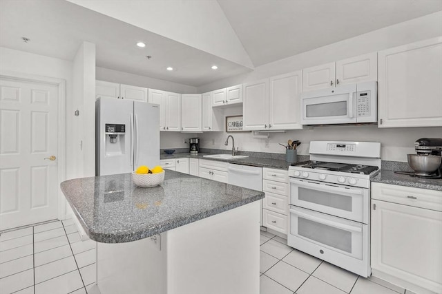 47 Blue Spruce Way Unit 47, Mashpee, MA 02649 - kitchen with light tile patterned floors, a sink, white appliances, vaulted ceiling, and recessed lighting