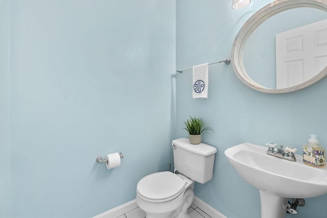 47 Blue Spruce Way Unit 47, Mashpee, MA 02649 - half bathroom featuring tile patterned floors, toilet, baseboards, and a sink