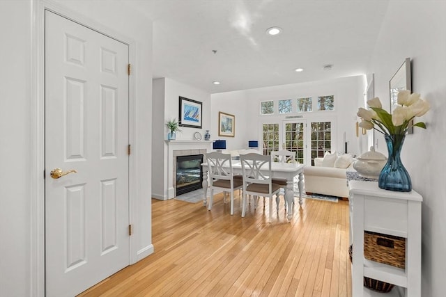 47 Blue Spruce Way Unit 47, Mashpee, MA 02649 - dining area featuring baseboards, recessed lighting, a tiled fireplace, and light wood-type flooring