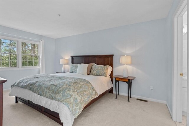 47 Blue Spruce Way Unit 47, Mashpee, MA 02649 - bedroom with visible vents, baseboards, and light carpet