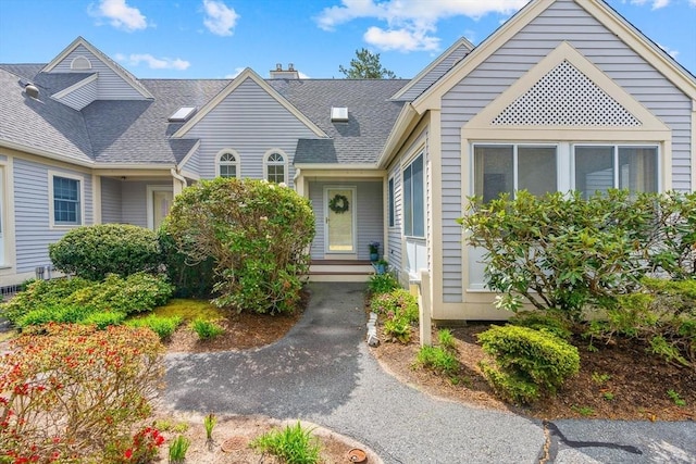 47 Blue Spruce Way Unit 47, Mashpee, MA 02649 - view of front of house with a chimney and a shingled roof
