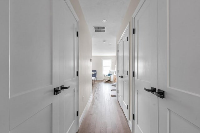 hall featuring light hardwood / wood-style floors