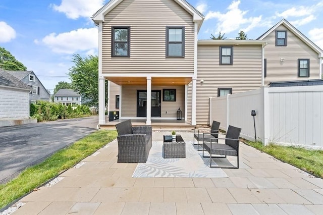 rear view of house featuring a patio area