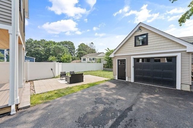 garage featuring a lawn