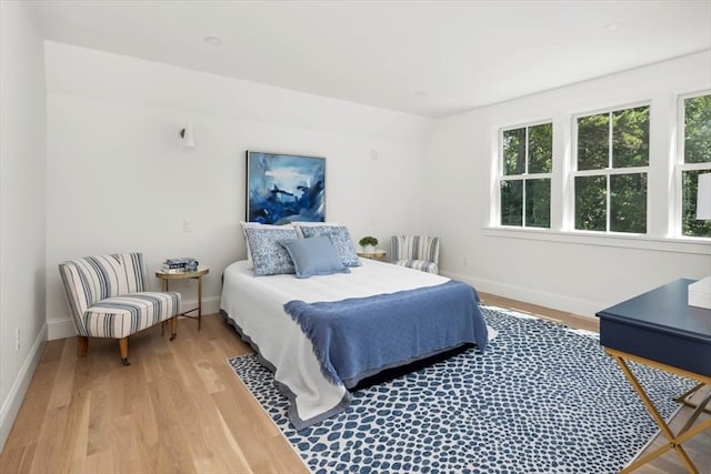 bedroom with light hardwood / wood-style flooring