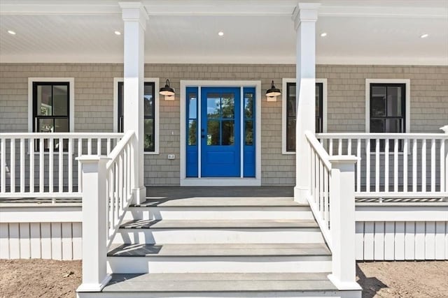 doorway to property featuring covered porch