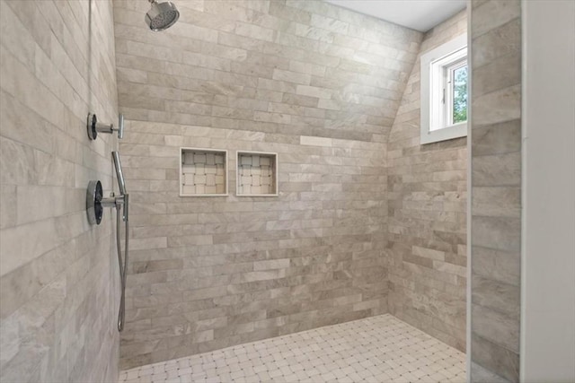 full bathroom featuring a tile shower