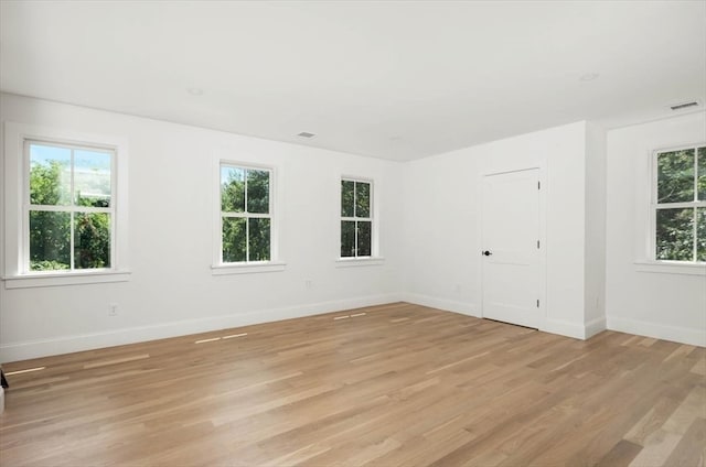 spare room with light wood-type flooring