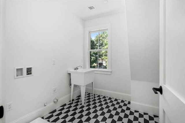 laundry area featuring washer hookup, visible vents, gas dryer hookup, laundry area, and baseboards