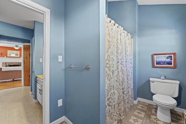 bathroom with ceiling fan, vanity, and toilet