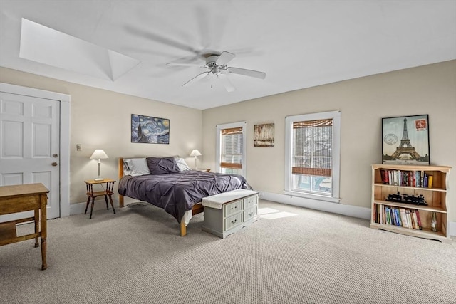 bedroom featuring ceiling fan and light carpet