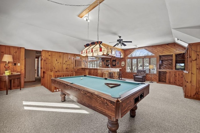 rec room with billiards, lofted ceiling, wooden walls, and light carpet