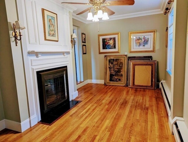 43 Brunswick Rd, Arlington, MA 02474 - sitting room featuring a ceiling fan, ornamental molding, baseboard heating, and a baseboard radiator
