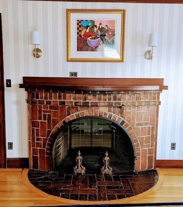 43 Brunswick Rd, Arlington, MA 02474 - interior details with a brick fireplace, baseboards, and wood finished floors