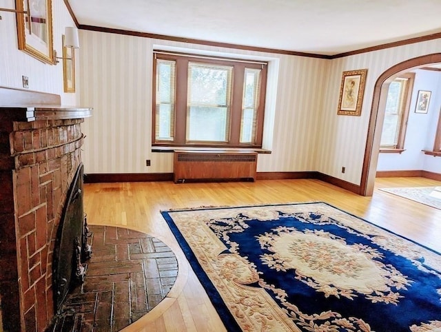 43 Brunswick Rd, Arlington, MA 02474 - interior space featuring crown molding, radiator, and hardwood / wood-style floors