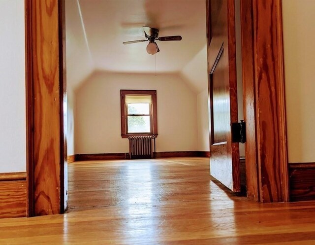 43 Brunswick Rd, Arlington, MA 02474 - bonus room featuring ceiling fan, radiator, baseboards, wood finished floors, and lofted ceiling