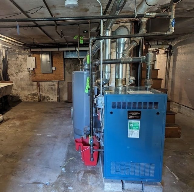 43 Brunswick Rd, Arlington, MA 02474 - utilities featuring a heating unit, water heater, and electric panel
