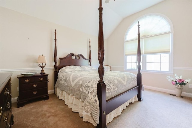 bedroom featuring carpet floors, lofted ceiling, and baseboards