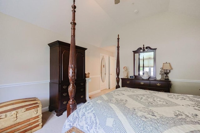 bedroom with light carpet, vaulted ceiling, and ceiling fan