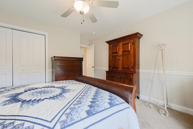 bedroom featuring a closet, carpet floors, baseboards, and a ceiling fan
