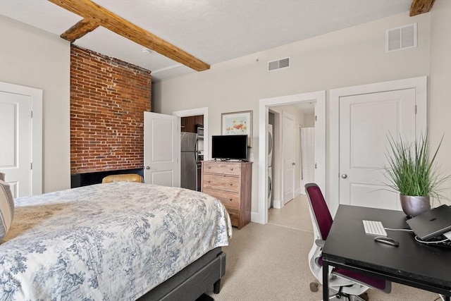 bedroom with visible vents, beamed ceiling, and freestanding refrigerator