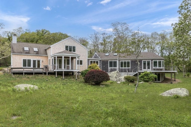 9 Beetlebung Grove Way, Chilmark, MA 02535 - rear view of house with a sunroom, a deck, a yard, and a chimney