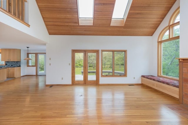 9 Beetlebung Grove Way, Chilmark, MA 02535 - unfurnished living room with wooden ceiling, high vaulted ceiling, healthy amount of natural light, light wood-style floors, and baseboards