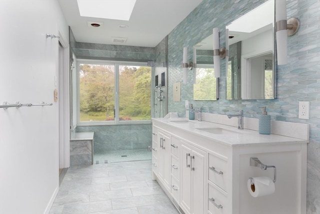 9 Beetlebung Grove Way, Chilmark, MA 02535 - full bathroom featuring a skylight, healthy amount of natural light, double vanity, and tile walls