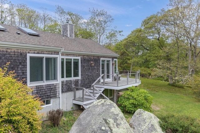 9 Beetlebung Grove Way, Chilmark, MA 02535 - rear view of house featuring a chimney, a deck, roof with shingles, and a yard