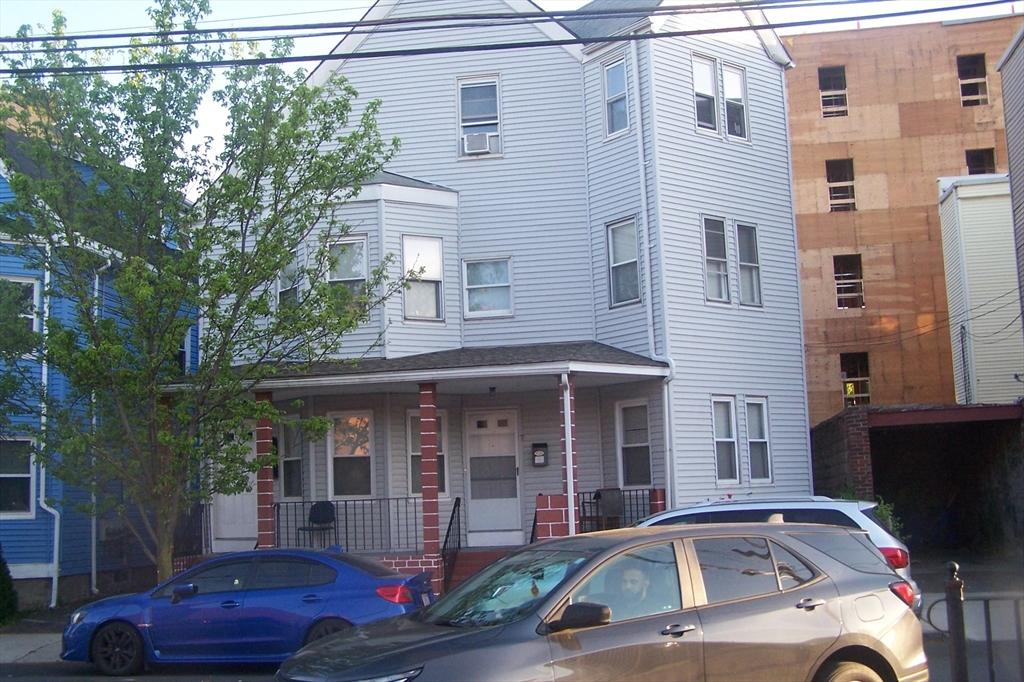 7-9 Gladstone St, Everett, MA 02149 - view of property featuring a porch and cooling unit