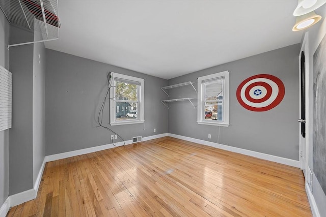 empty room featuring hardwood / wood-style flooring