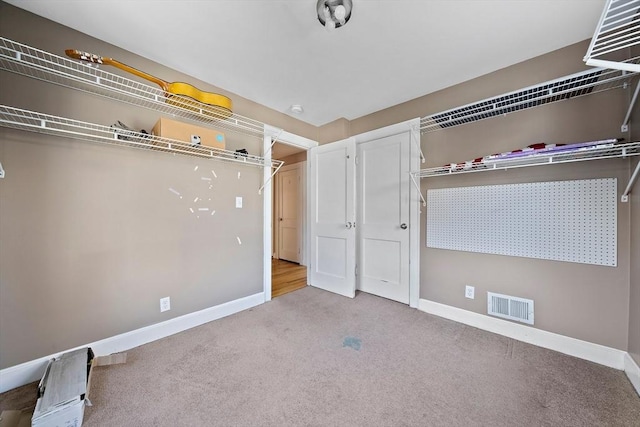 unfurnished bedroom with light colored carpet