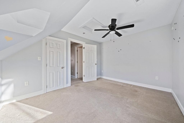 additional living space featuring ceiling fan, light colored carpet, and lofted ceiling