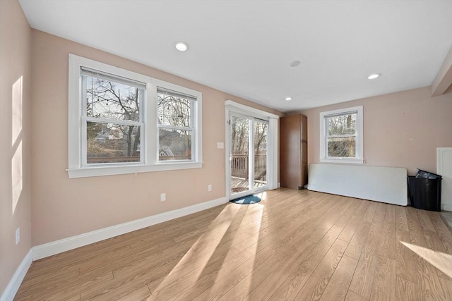 unfurnished living room with light hardwood / wood-style flooring