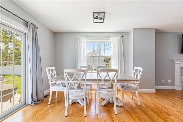 0 Thompson St, Middleboro, MA 02346 - dining room with plenty of natural light, wood finished floors, and a fireplace