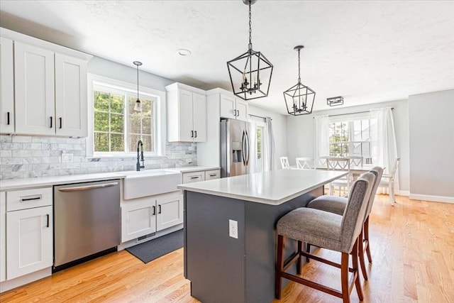 0 Thompson St, Middleboro, MA 02346 - kitchen with stainless steel appliances, a chandelier, a breakfast bar, and plenty of natural light