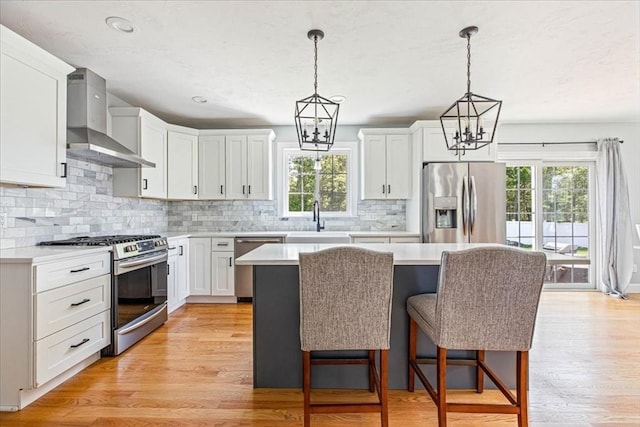 0 Thompson St, Middleboro, MA 02346 - kitchen featuring wall chimney range hood, stainless steel appliances, healthy amount of natural light, light countertops, and recessed lighting