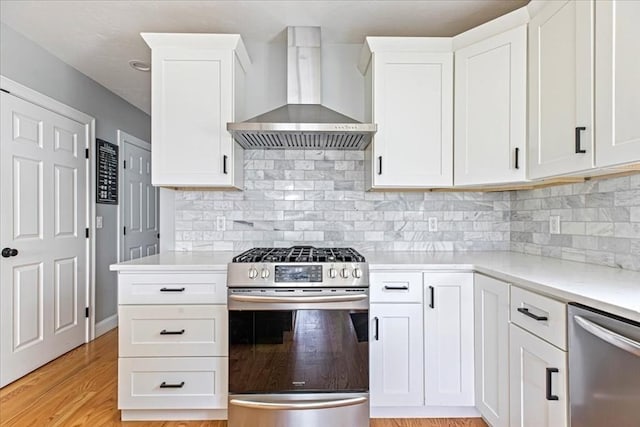 0 Thompson St, Middleboro, MA 02346 - kitchen with appliances with stainless steel finishes, wall chimney exhaust hood, light countertops, and white cabinetry
