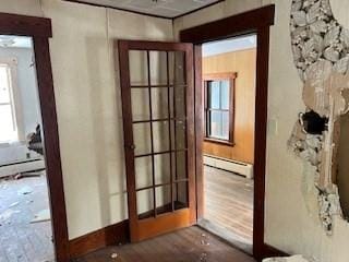 entryway featuring a baseboard radiator and hardwood / wood-style floors