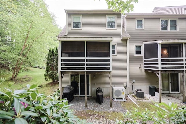 8 Heritage Dr Unit 8, Medway, MA 02053 - back of house featuring ac unit, a sunroom, and central AC