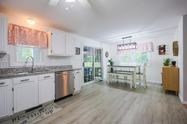 8 Heritage Dr Unit 8, Medway, MA 02053 - kitchen with dishwasher, a sink, light stone countertops, backsplash, and white cabinetry