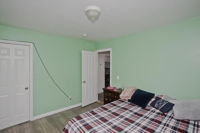 bedroom with hardwood / wood-style flooring