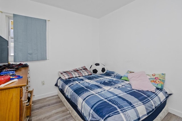 bedroom with light hardwood / wood-style flooring