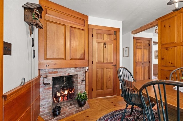 interior space with wood-type flooring and a fireplace
