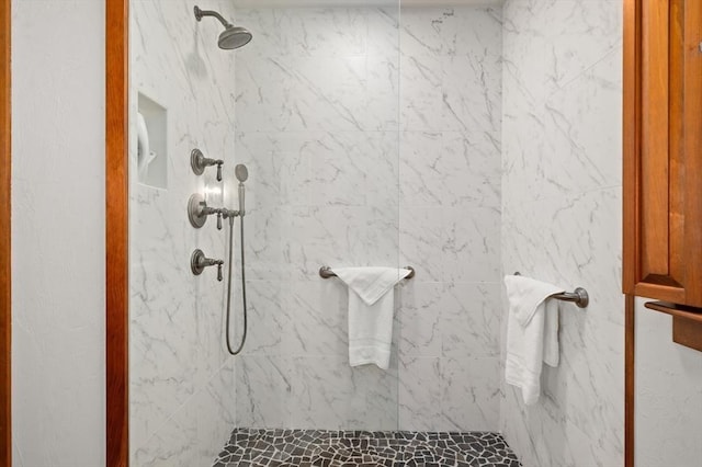 full bath with a tile shower