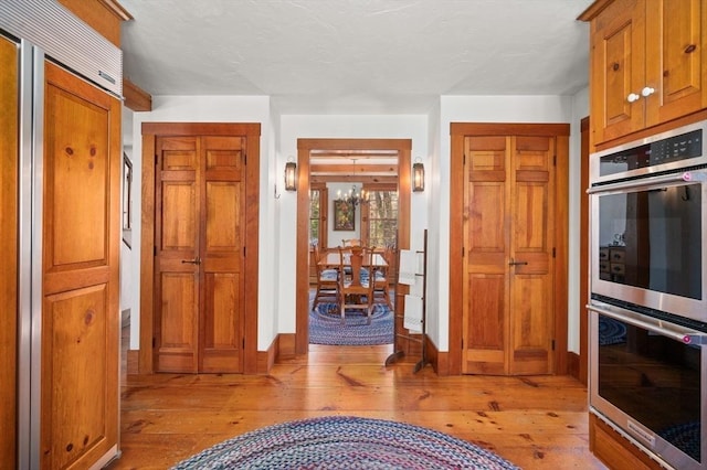 interior space with light wood-style flooring and baseboards