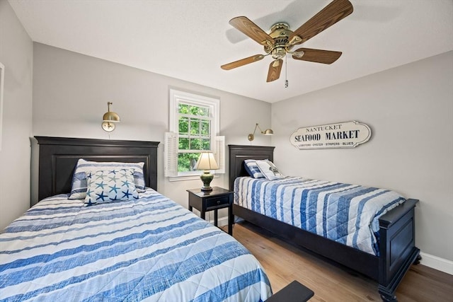 111 Richardson Rd, Barnstable, MA 02632 - bedroom with wood finished floors, a ceiling fan, and baseboards