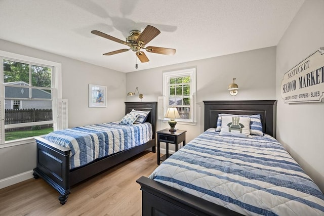 111 Richardson Rd, Barnstable, MA 02632 - bedroom with light wood-style floors, ceiling fan, and baseboards