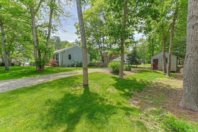 111 Richardson Rd, Barnstable, MA 02632 - view of green lawn featuring gravel driveway